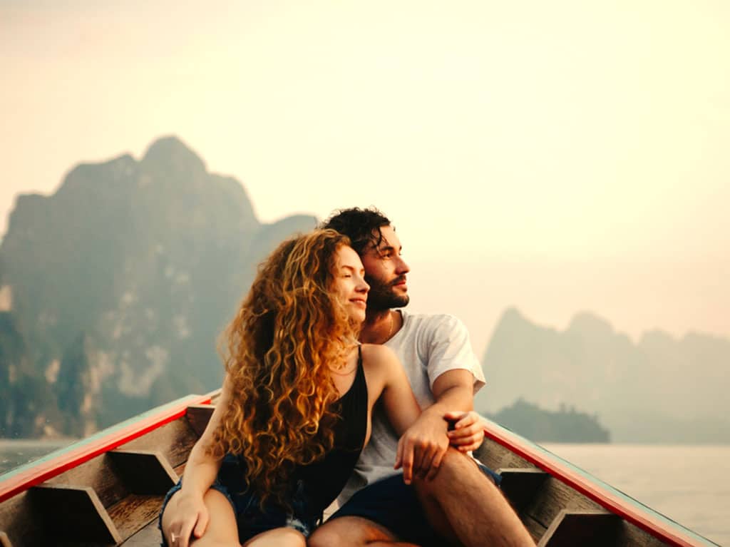 newlyweds on a boat in thailand