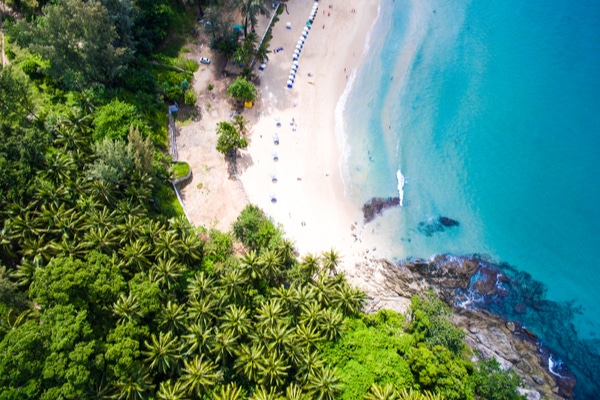 Surin Beach North End as seen from a drone hovering above the beach giving a clear view of the turquoise water