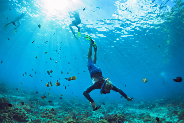 man snorkeling down to the depths in Phuket