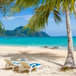 Scenic Laem Ka Beach in Thailand with clear blue water.