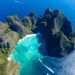 Maya Bay and it's incredible cove hideaway as seen from a drone shot far above the pristine waters.