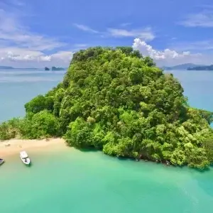 Two boats near a picturesque island in the Andaman Sea
