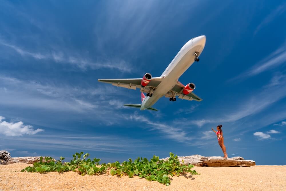 a plane arrives at phuket island