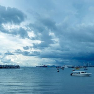 A beautiful shot over the Andaman Sea with boats in the foreground and cloudy skies in the background