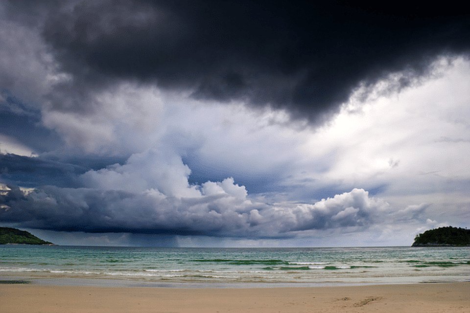 Monsoon storm clouds and surf on Phuket's west coast in the green season